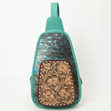 Western-style cowhide leather sling bag with floral tooled front pocket and adjustable strap by American Darling 

