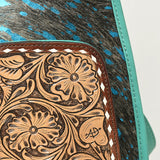 Western-style cowhide leather sling bag with floral tooled front pocket and adjustable strap by American Darling 

