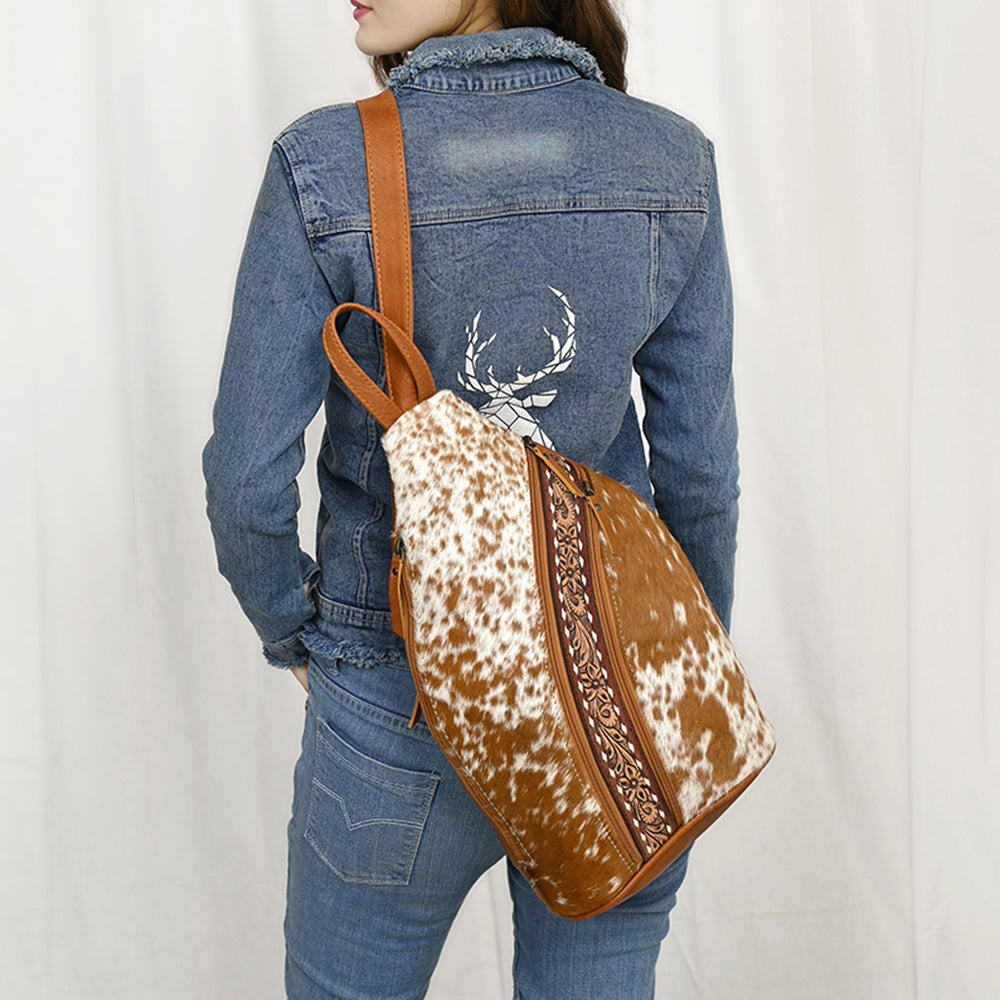 ADBG1513 Hair-On Cowhide Sling Backpack with Hand Tooled Leather Accents