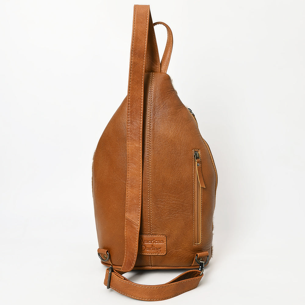 ADBG1513 Hair-On Cowhide Sling Backpack with Hand Tooled Leather Accents