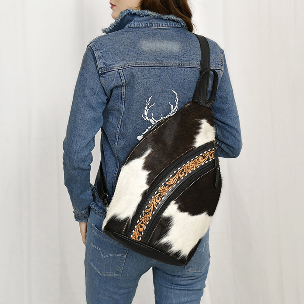 ADBG1514 Black & White Cowhide Sling Backpack with Tooled Leather Accents