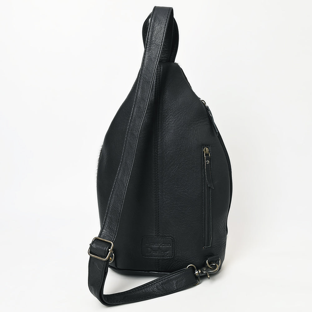 ADBG1514 Black & White Cowhide Sling Backpack with Tooled Leather Accents