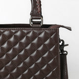 Quilted brown leather crossbody bag with hand-tooled floral leather accent, braided top handles, and adjustable shoulder strap
