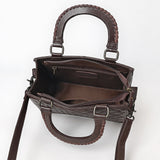 Quilted brown leather crossbody bag with hand-tooled floral leather accent, braided top handles, and adjustable shoulder strap
