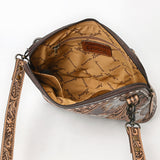 Tooled leather crossbody bag with silver sunflower carvings and matching tooled shoulder strap

