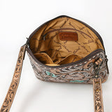 Hand-tooled leather crossbody bag with floral carving, turquoise accents, and tooled strap

