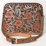 Tooled leather crossbody bag with pink floral carvings, silver scroll accents, and matching tooled leather strap


