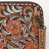Tooled leather crossbody bag with pink floral carvings, silver scroll accents, and matching tooled leather strap

