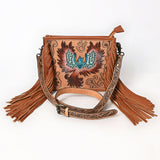 Tooled leather crossbody bag with hand-painted phoenix design, long leather fringe, and floral tooled strap

