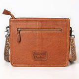 Tooled leather crossbody bag with hand-painted phoenix design, long leather fringe, and floral tooled strap


