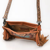 Tooled leather crossbody bag with hand-painted phoenix design, long leather fringe, and floral tooled strap

