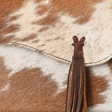 Genuine cowhide leather crossbody bag with brown and white tri-color pattern, fringe tassel, and antique brass chain strap

