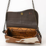 Genuine cowhide leather crossbody bag with brown and white tri-color pattern, fringe tassel, and antique brass chain strap

