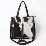 ADBG1751 Black & White Cowhide Leather Tote Bag with Silver Stud Accents and Concho Tassel